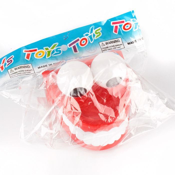 Игрушка "Заводная челюсть" Игрушка "Заводная челюсть"